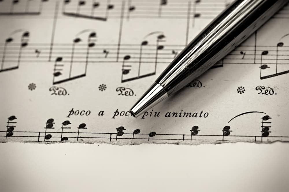 Pen on Sheet Music for Wedding - Poco a Poco Piu Animato